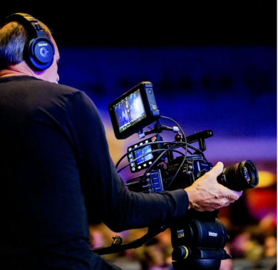 Man filming an event